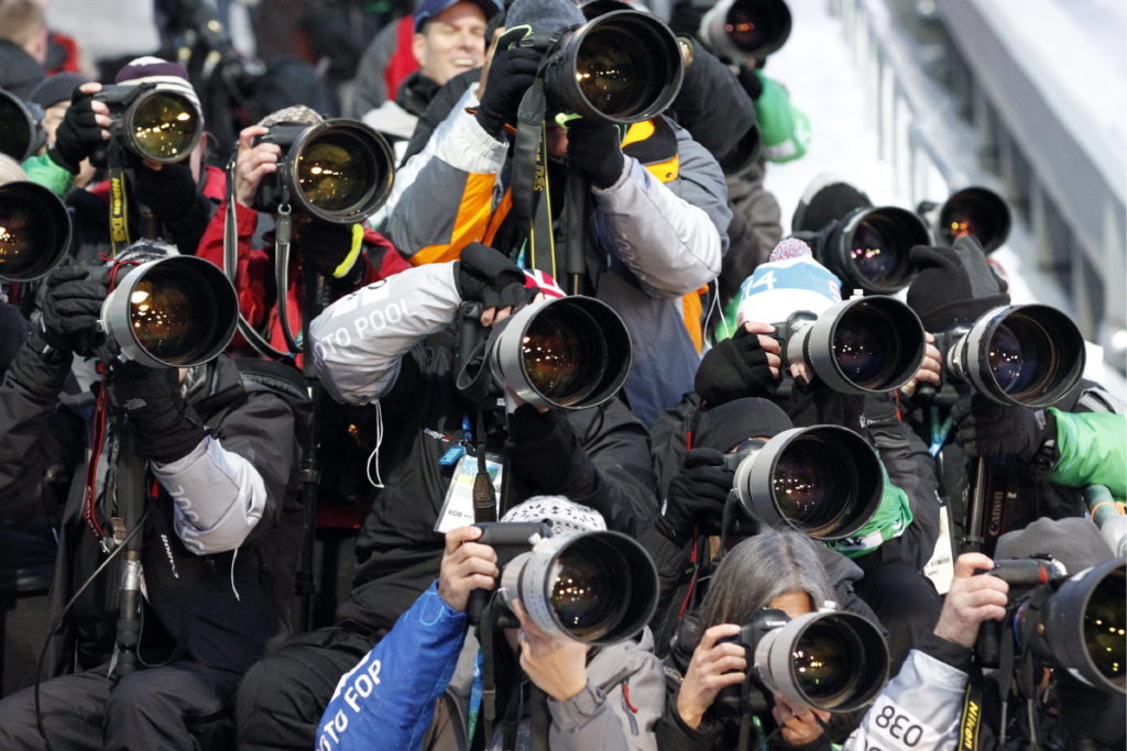 Photographers take pictures during the men's heat 3 of the skeleton competition in the Whistler Sliding Center at the XXI Olympic Winter Games in Whistler near Vancouver, British Columbia, Canada, pictured on Friday, February 19, 2010. (KEYSTONE/Alessandro Della Bella)